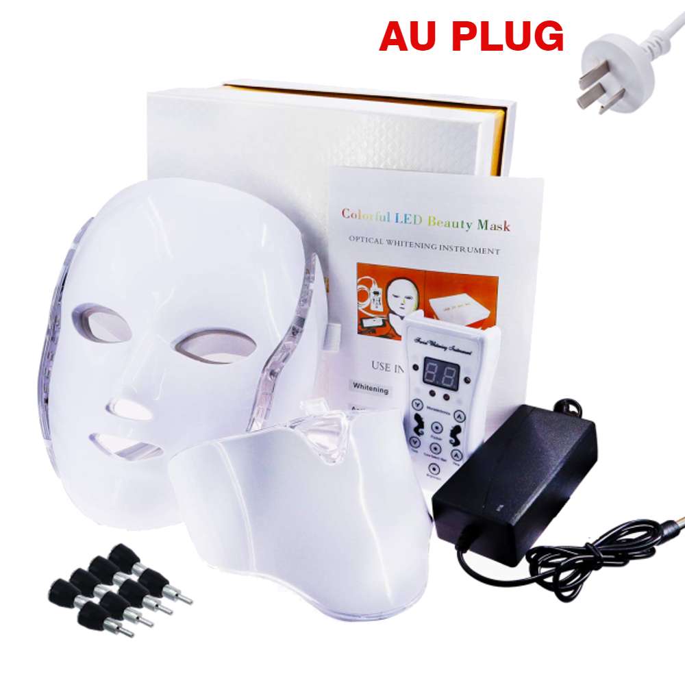 An image displaying the contents of a Photon Facial LED Light Therapy Mask kit, including the mask itself, a box, a manual, and an AU plug type. The kit provides users with everything they need to get started with the mask, which features seven different color LEDs for treating various skin conditions.